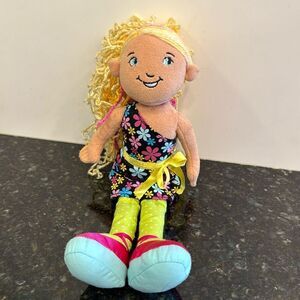 Denell -A blonde with a black floral dress.- Manhattan Toys. Size 13”